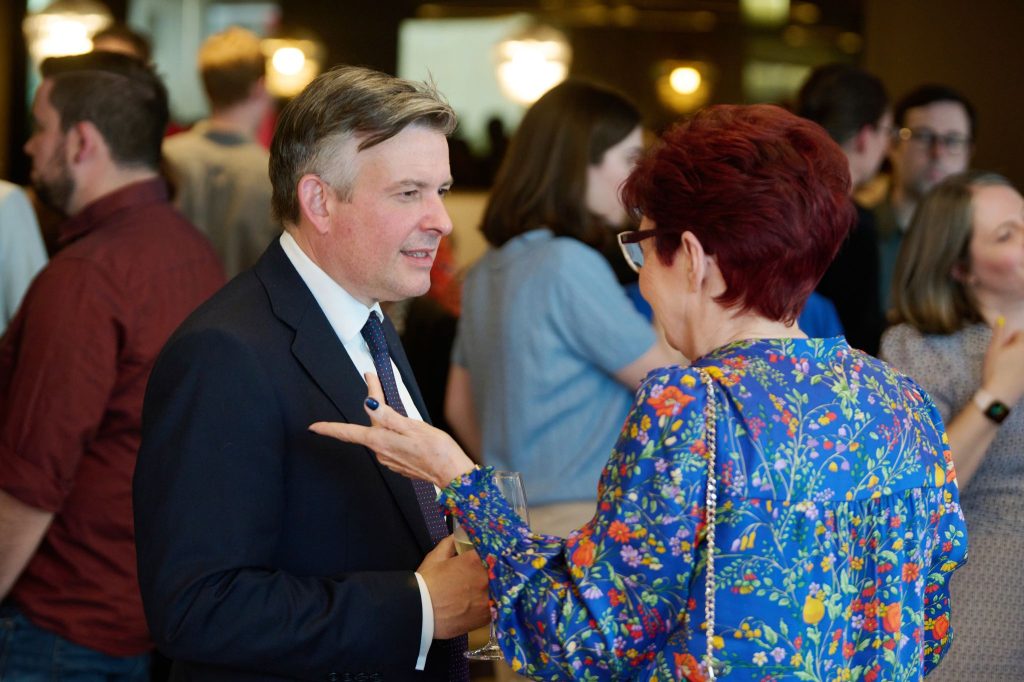 Jonathan Ashworth MP speaks to a woman at an event